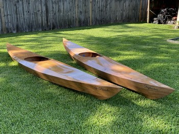 2 kayaks on the grass